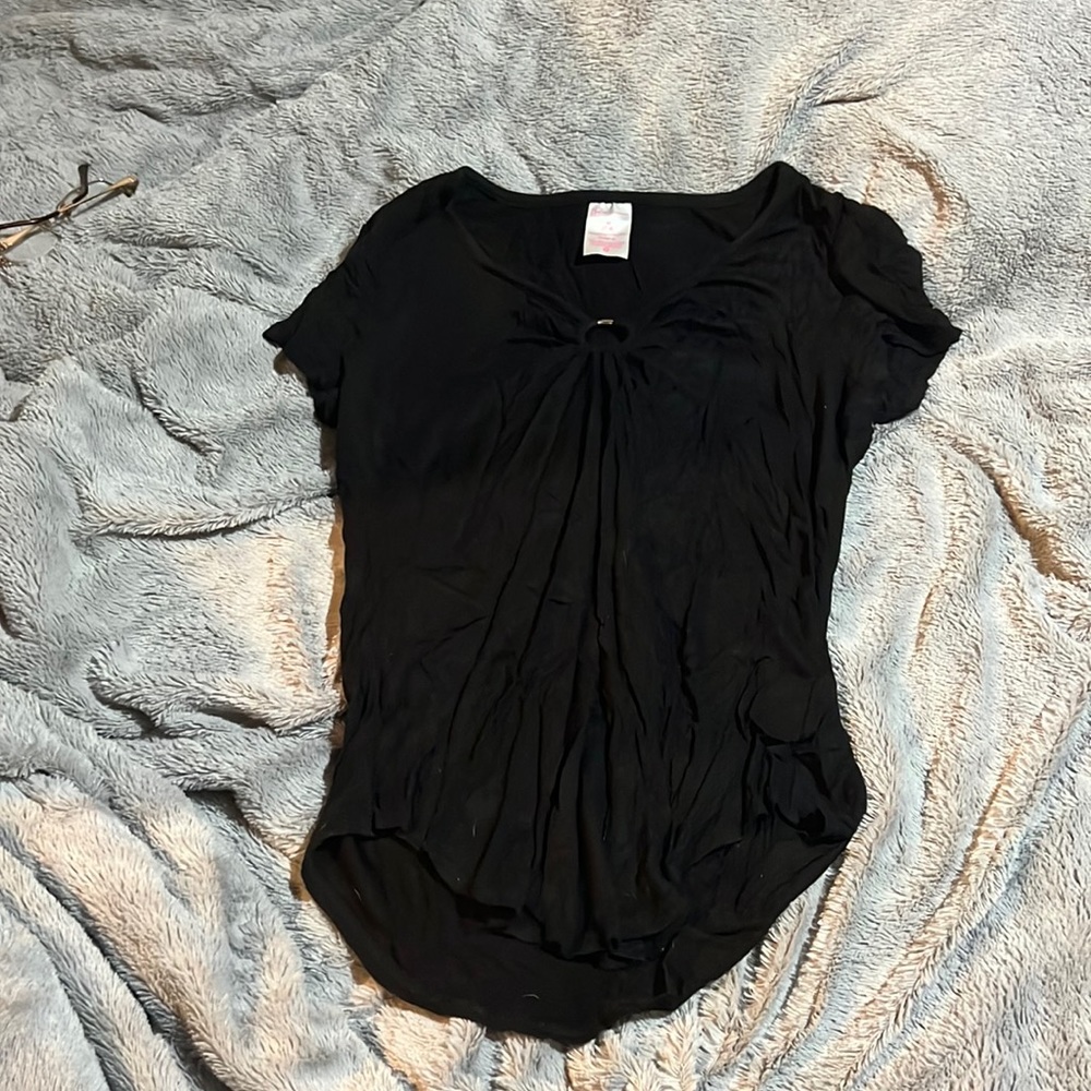 Black shirt with silver circle in front